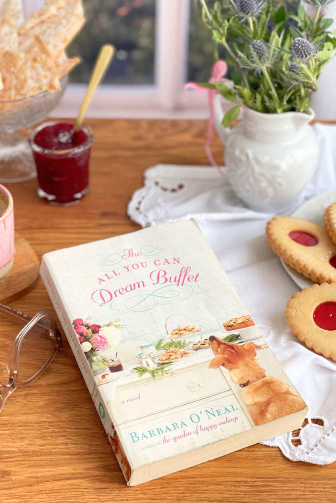 the all you can dream buffet article deliciouslyhome1 Exemplaire de The All You Can Dream Buffet de Barbara O’Neal posé près d’un café et de douceurs, lecture feel good de mars sur Deliciously Home.